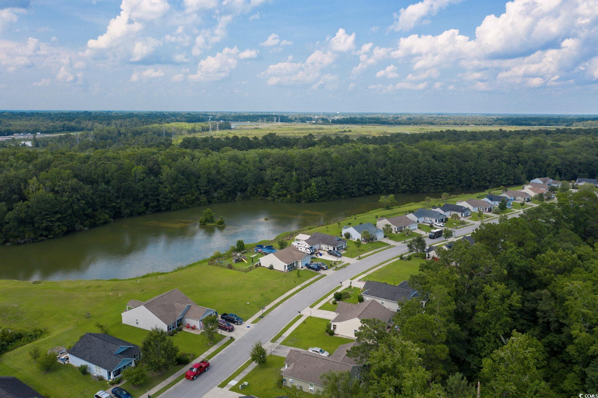 1245 Pine Ridge Street Conway, SC 29527 - Photo 27 of 28 Aerial view of residential area featuring a nearby body of water and a heavily wooded area