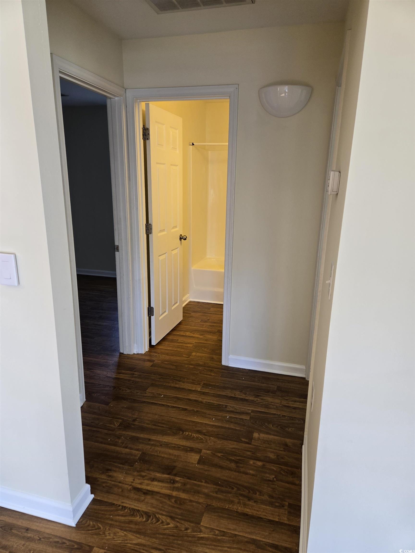 1245 Pine Ridge Street Conway, SC 29527 - Photo 6 of 28 Corridor featuring dark wood-style flooring and baseboards