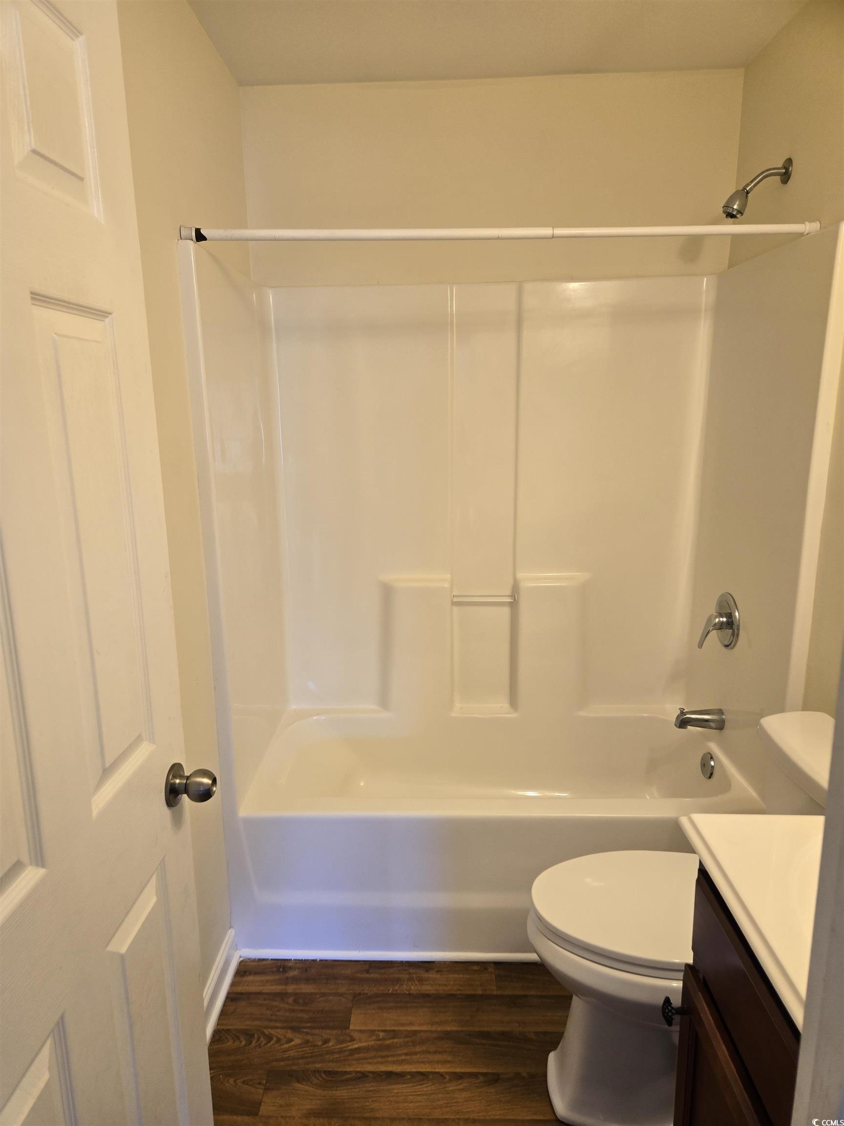 1245 Pine Ridge Street Conway, SC 29527 - Photo 7 of 28 Bathroom with vanity, dark wood-style floors, and shower combination