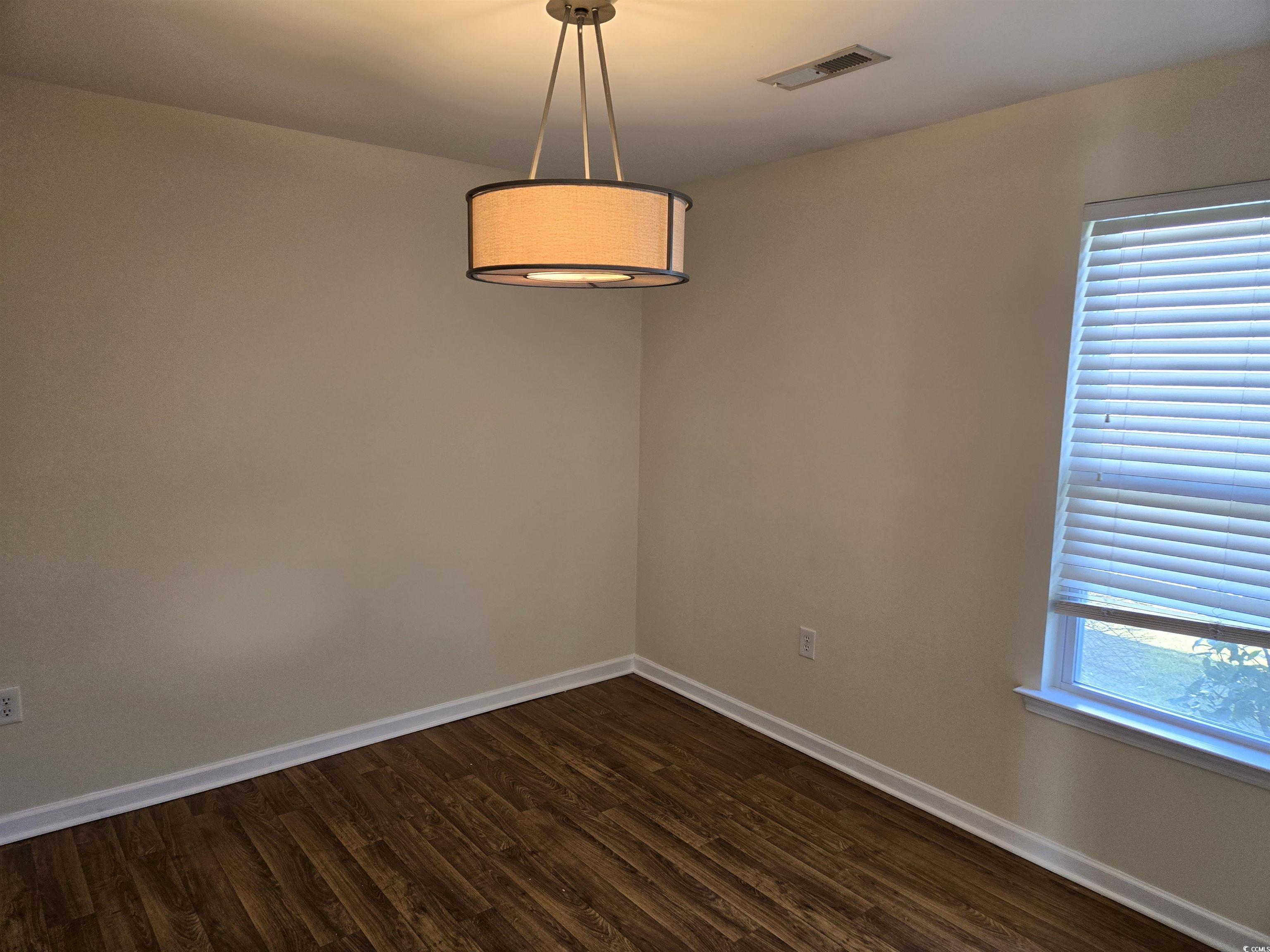 1245 Pine Ridge Street Conway, SC 29527 - Photo 8 of 28 Unfurnished room featuring dark wood-style flooring and healthy amount of natural light