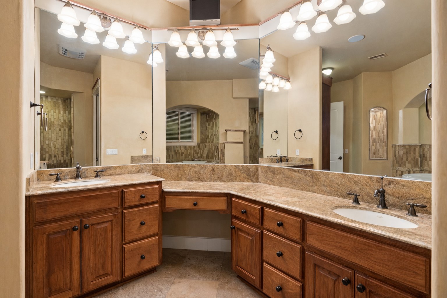 23426 Oscar Road Spicewood, TX 78669 - Photo 23 of 40 View of the primary bathroom's double vanity.