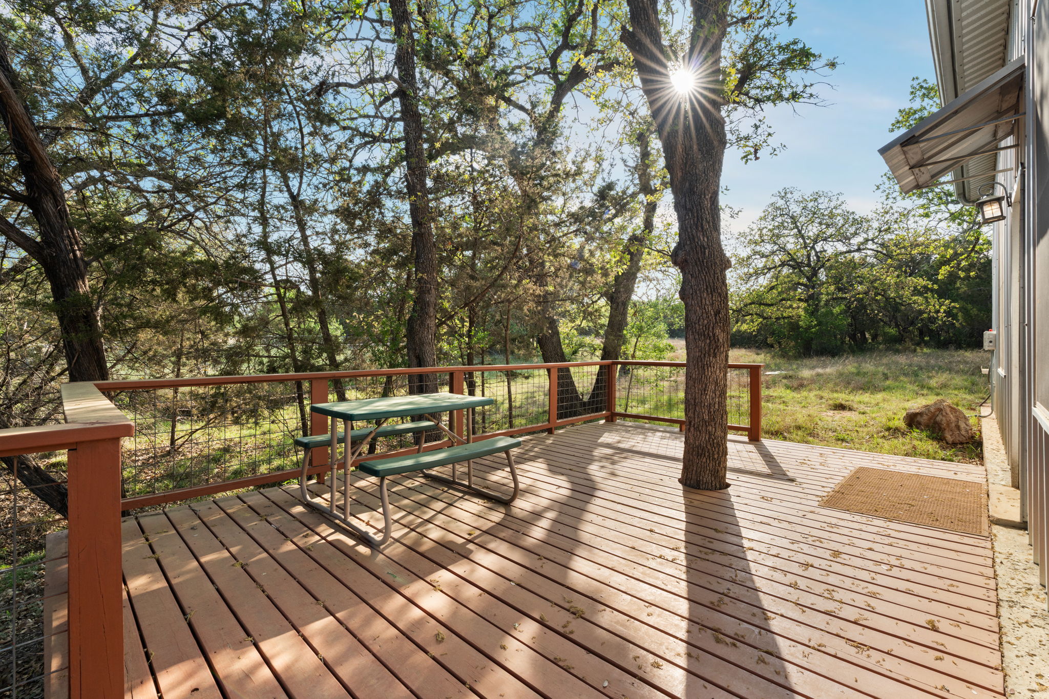 23426 Oscar Road Spicewood, TX 78669 - Photo 29 of 40 The guest house has a generously sized attached deck.
This space would make for excellent multi-generational living, visiting family and friends, or a wonderful work from home space.