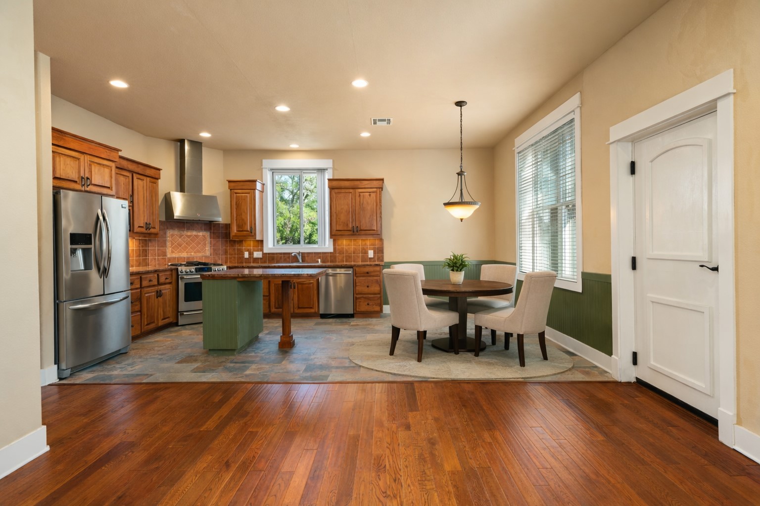 23426 Oscar Road Spicewood, TX 78669 - Photo 30 of 40 View of the kitchen and dining area inside the guest house. Virtually staged.