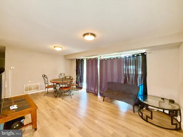 a view of a livingroom with furniture and a table
