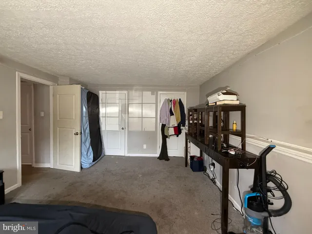 a view of a hallway with workspace