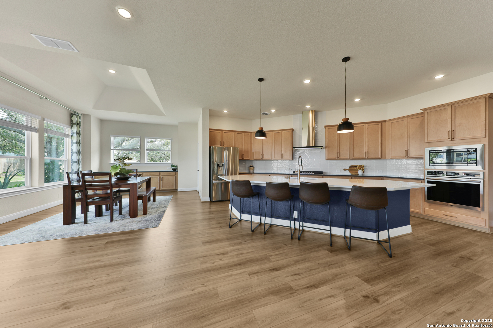195 Piper Street Castroville, TX 78009 - Photo 14 of 47 a kitchen with a dining table chairs and kitchen view