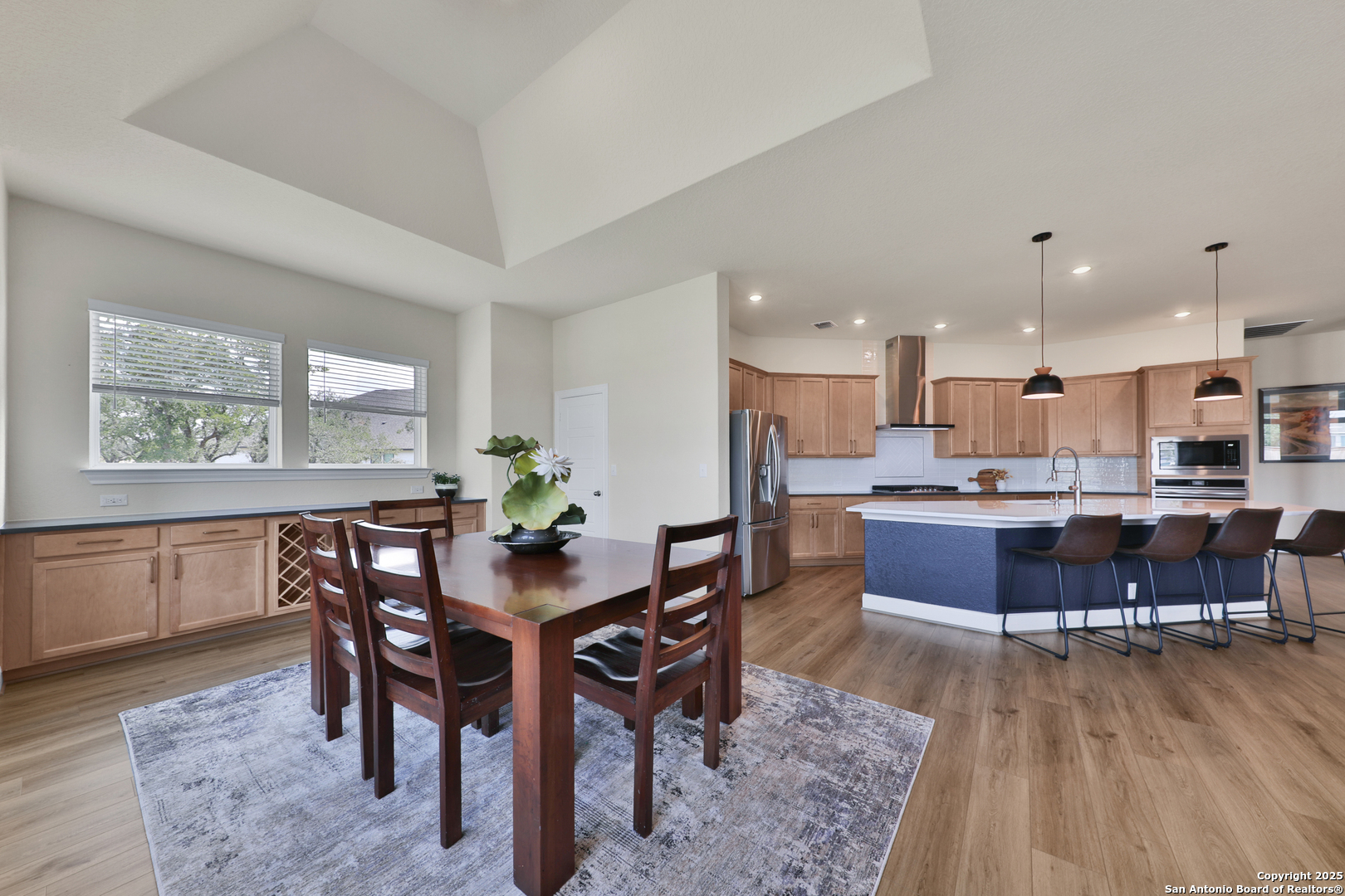 195 Piper Street Castroville, TX 78009 - Photo 16 of 47 a view of a dining room with furniture and wooden floor