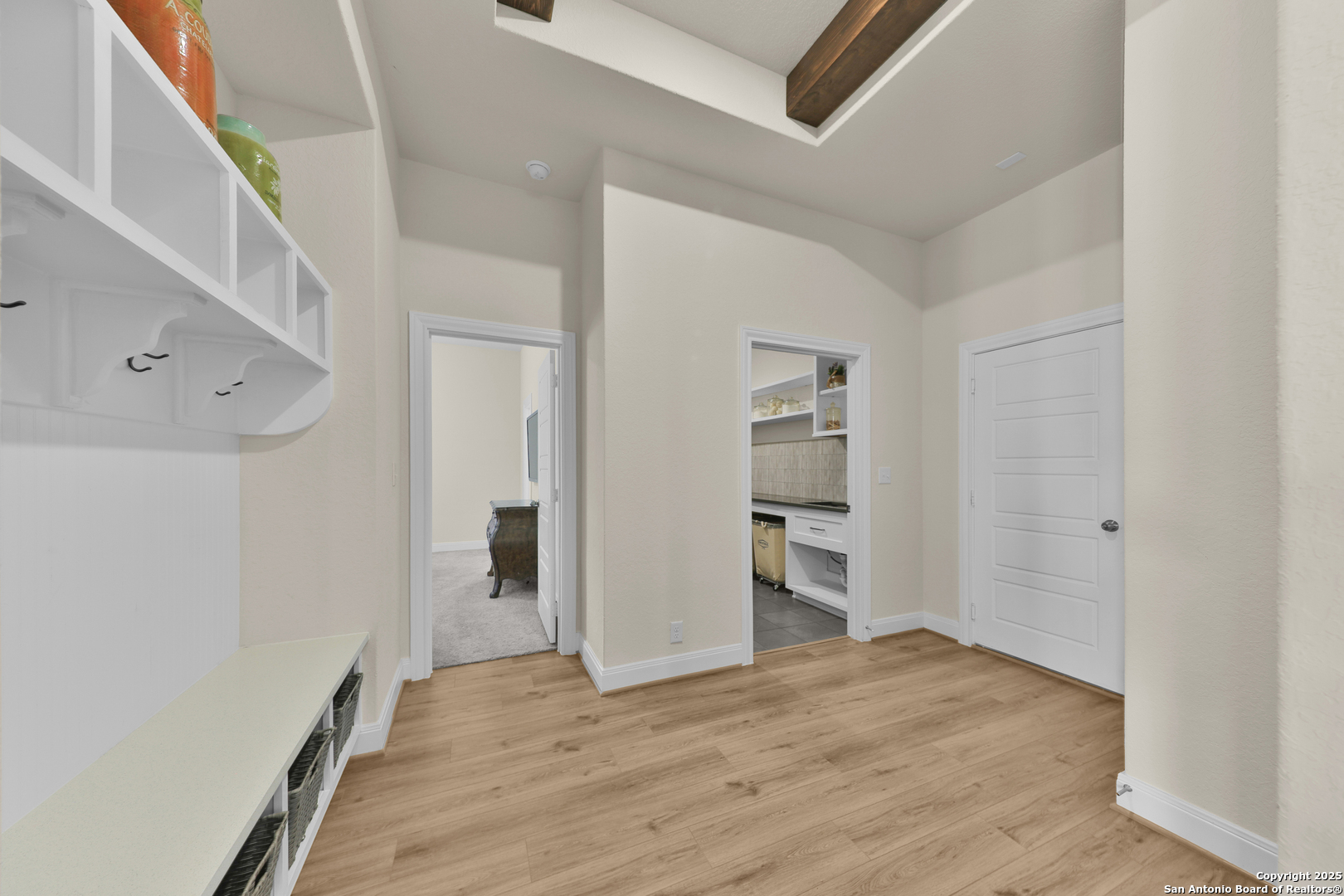 195 Piper Street Castroville, TX 78009 - Photo 17 of 47 a view of empty room with wooden floor