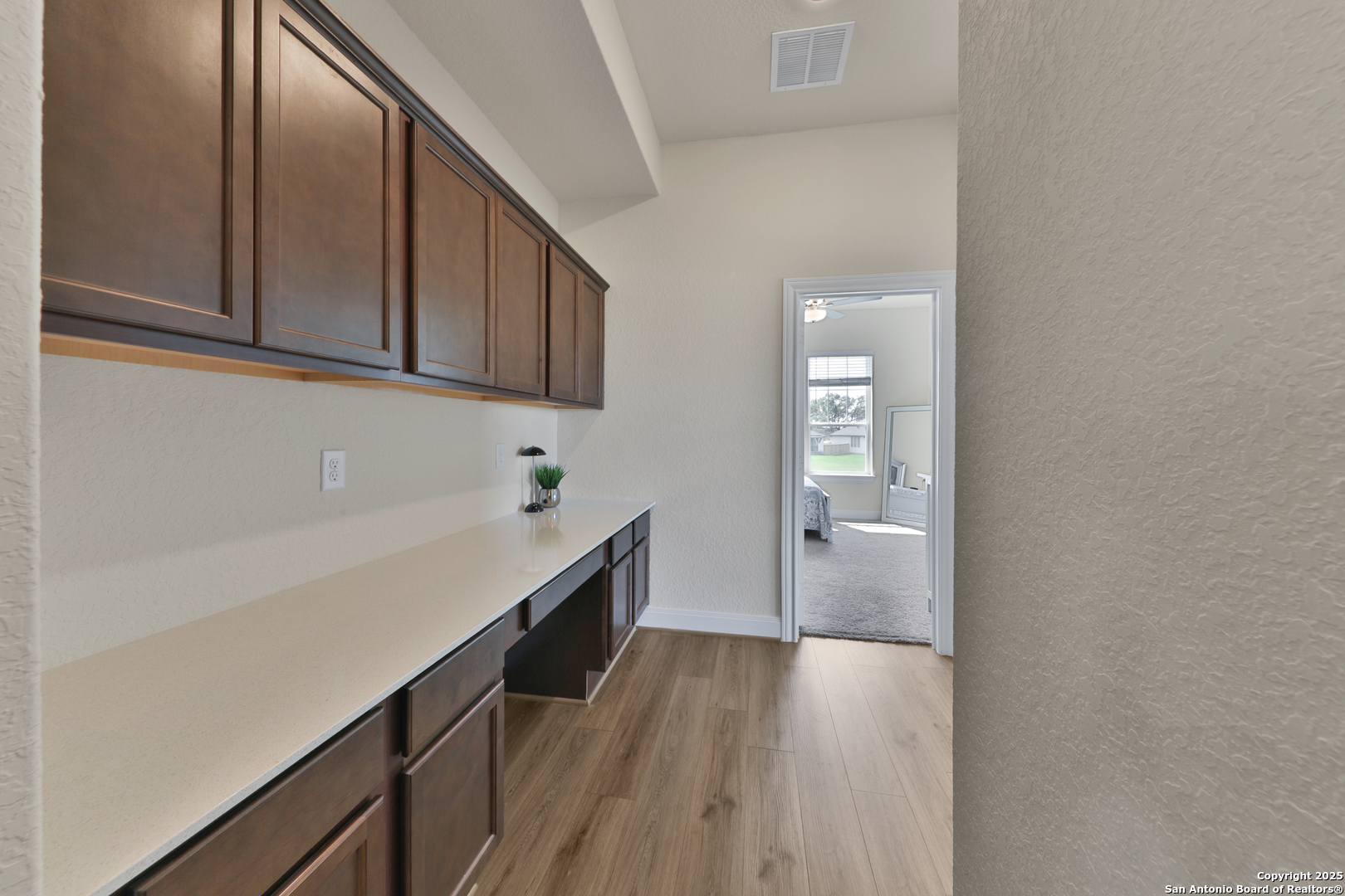 195 Piper Street Castroville, TX 78009 - Photo 23 of 47 a kitchen with a refrigerator and a sink