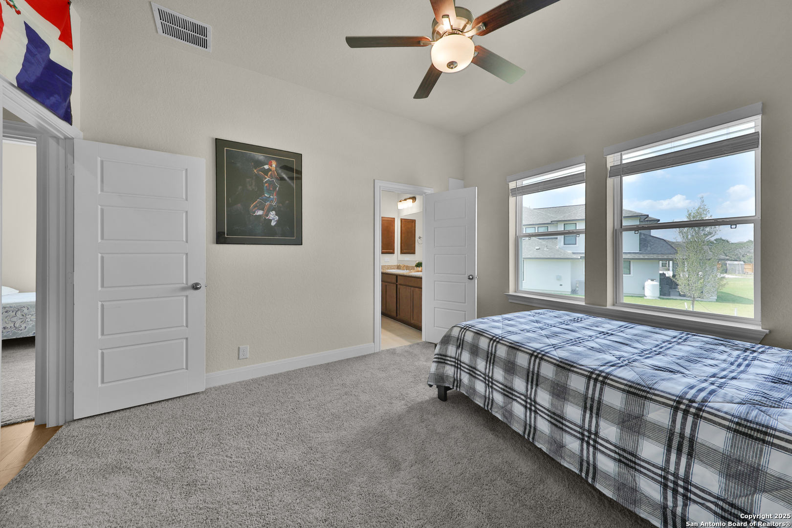 195 Piper Street Castroville, TX 78009 - Photo 26 of 47 a bedroom with a bed and a window