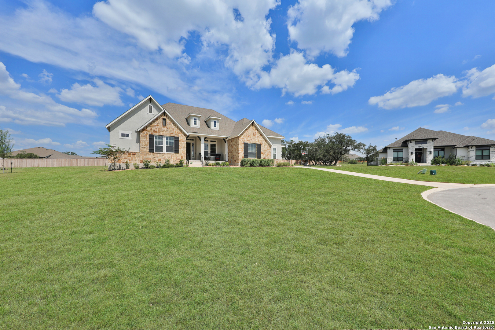195 Piper Street Castroville, TX 78009 - Photo 3 of 47 a view of a house with a big yard