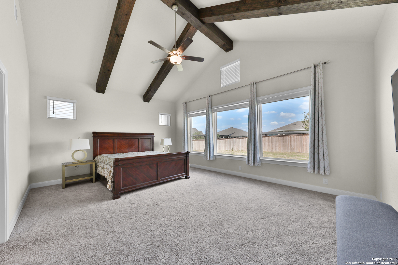 195 Piper Street Castroville, TX 78009 - Photo 32 of 47 a living room with furniture and a flat screen tv