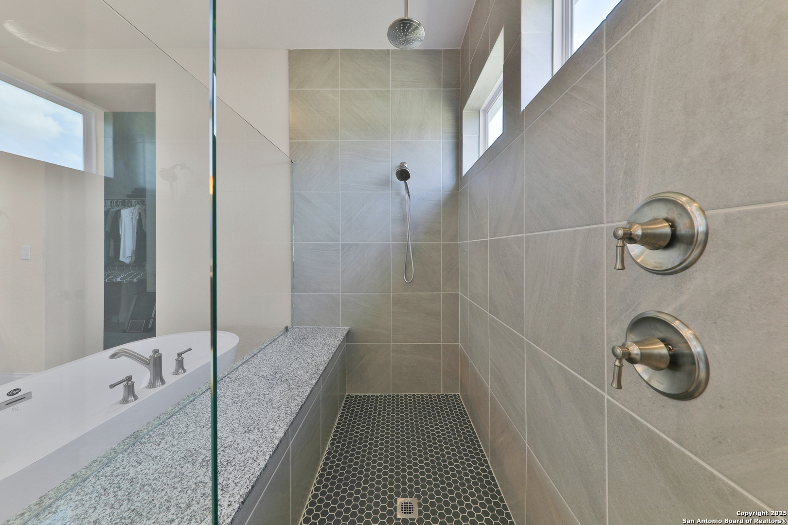 195 Piper Street Castroville, TX 78009 - Photo 34 of 47 a bathroom with a tub and shower