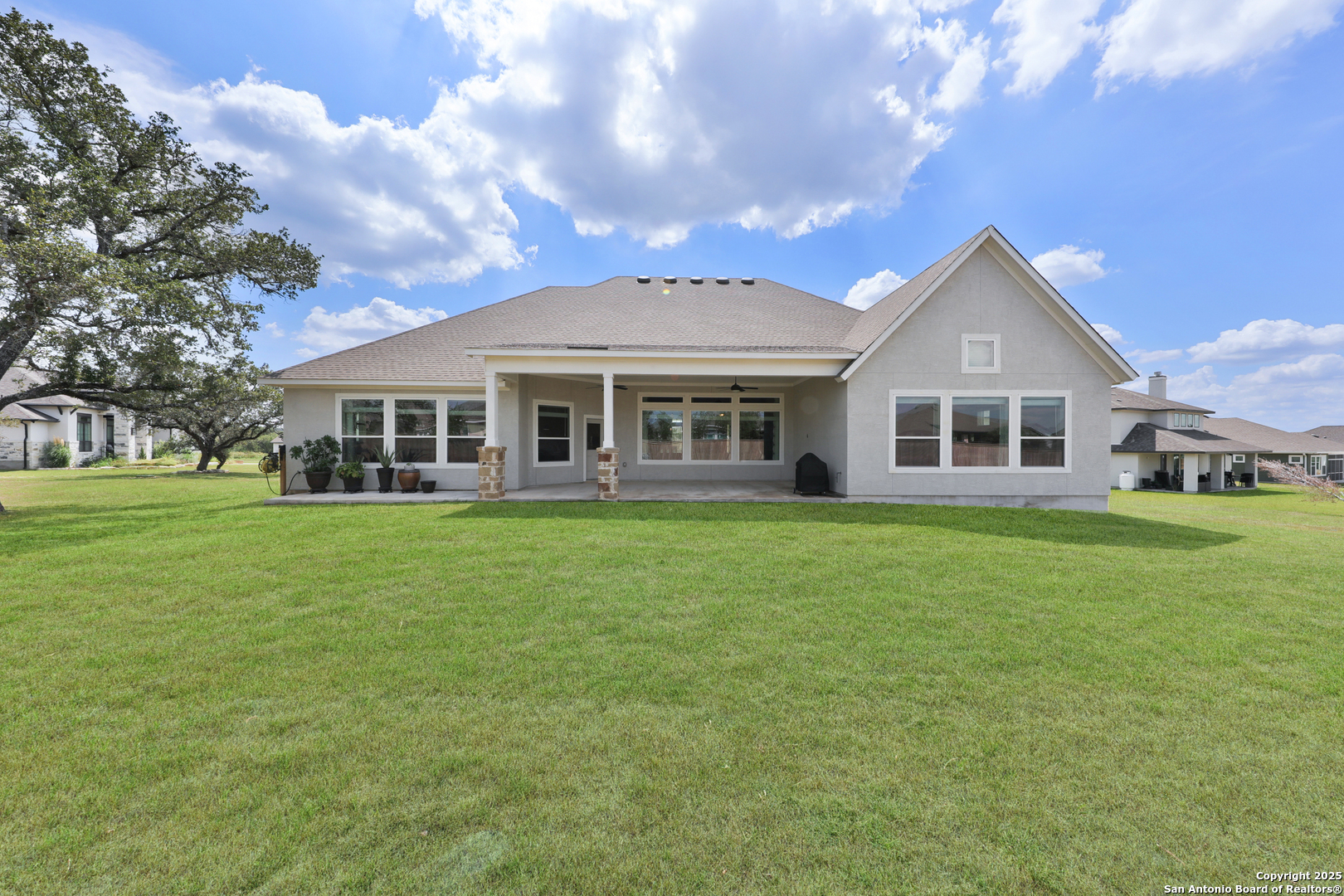 195 Piper Street Castroville, TX 78009 - Photo 42 of 47 a front view of a house with a garden