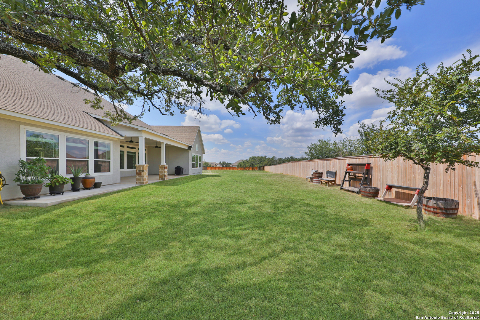 195 Piper Street Castroville, TX 78009 - Photo 45 of 47 a front view of a house with a garden
