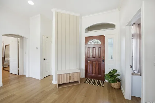 a view of entryway with wooden floor