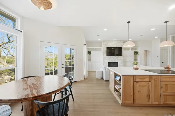a open kitchen with stainless steel appliances granite countertop a stove and a view of dining room