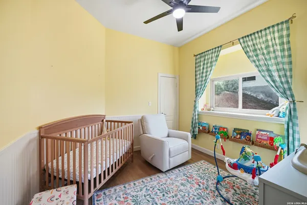a bedroom with furniture and a window