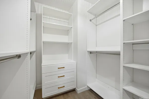 a view of an empty walk in closet