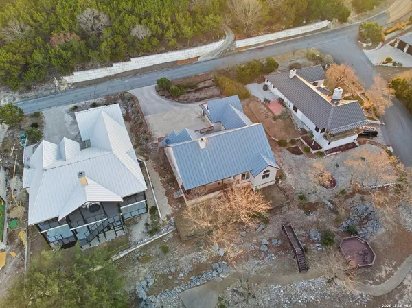 an aerial view of a house with outdoor space