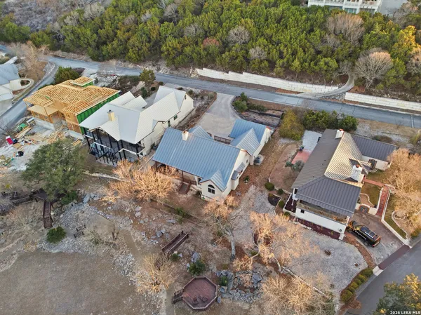 an aerial view of a house with a yard
