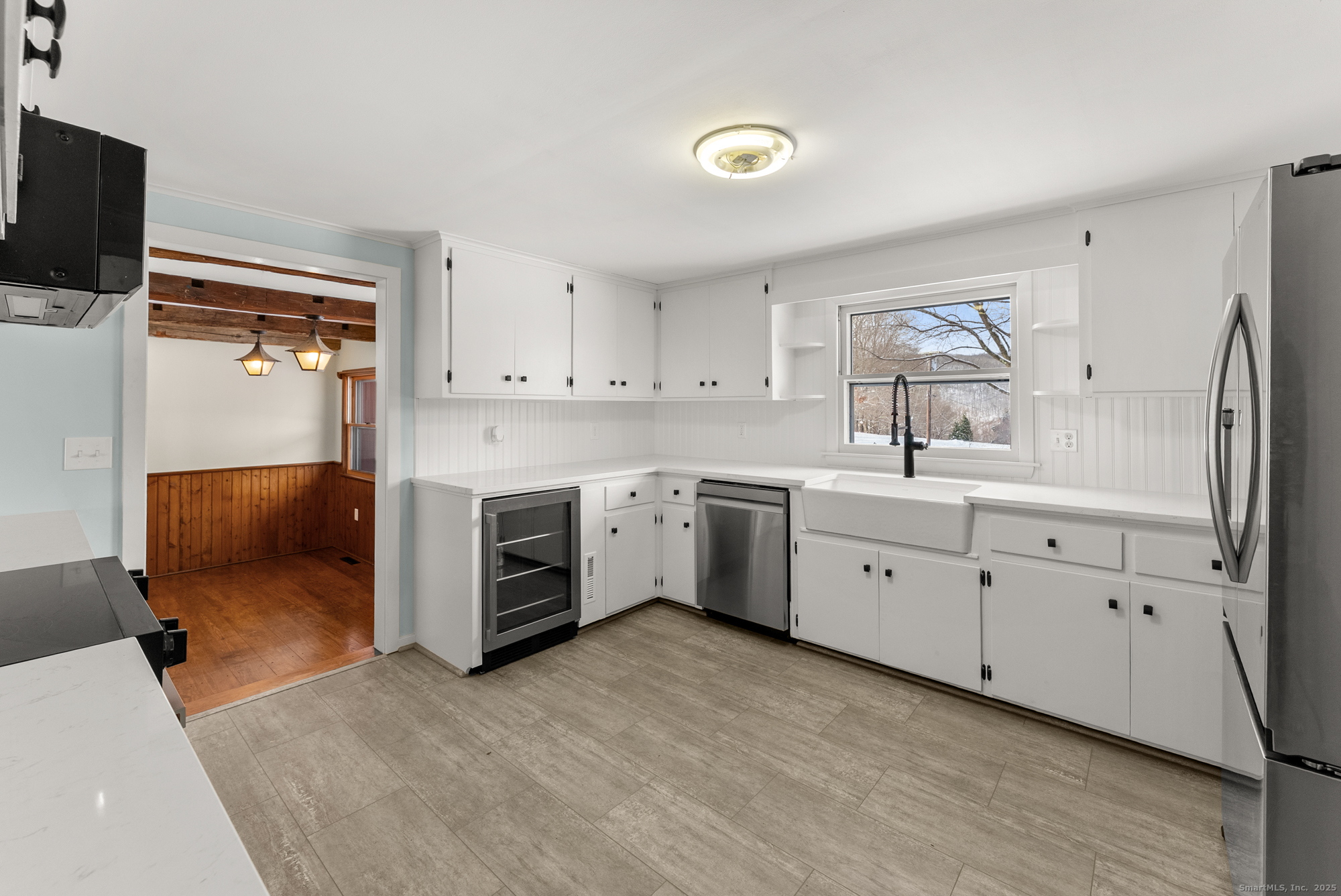 52 B Fuller Mountain Road Kent, CT 06757 - Photo 11 of 25 a kitchen with white cabinets and white appliances