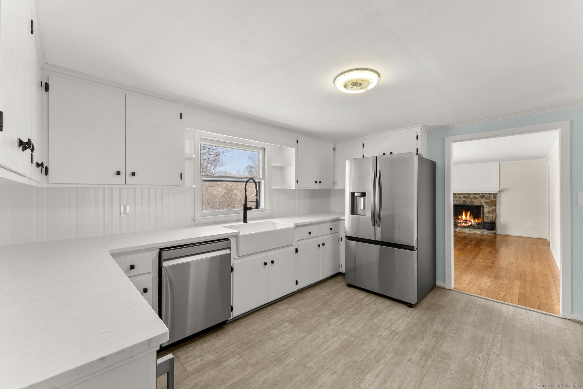 52 B Fuller Mountain Road Kent, CT 06757 - Photo 12 of 25 a kitchen with white cabinets and stainless steel appliances