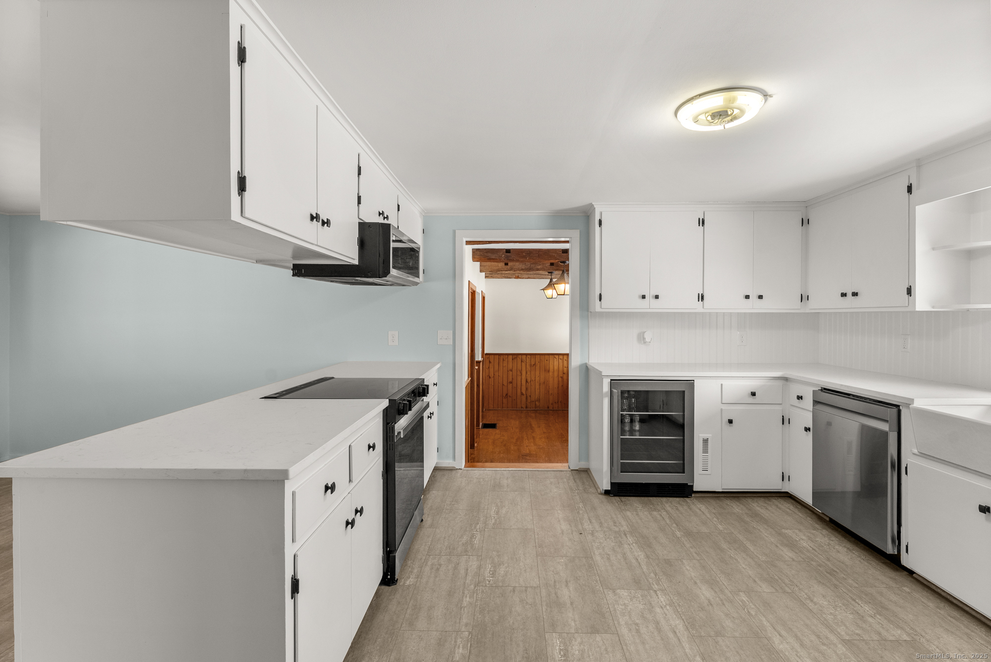 52 B Fuller Mountain Road Kent, CT 06757 - Photo 13 of 25 a kitchen with a stove top oven sink and cabinets