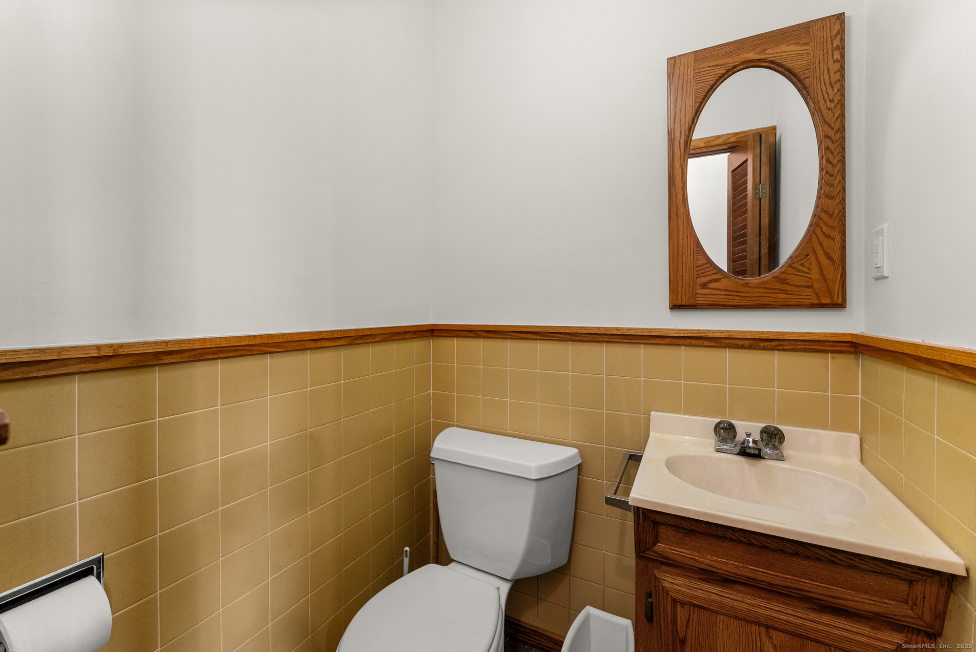 52 B Fuller Mountain Road Kent, CT 06757 - Photo 10 of 25 a bathroom with a toilet a sink and mirror