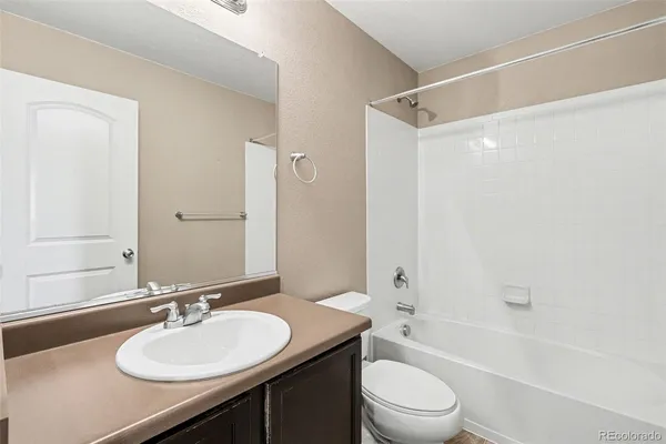 a bed room with furniture and a potted plant