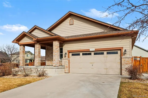 a front view of a house with a garage