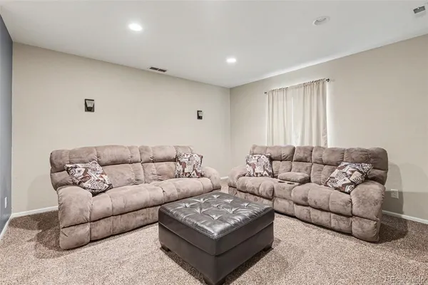 a living room with furniture and a couch