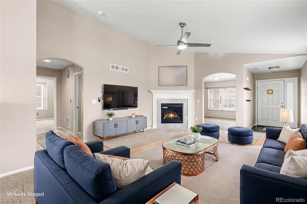 a living room with furniture fireplace and a flat screen tv