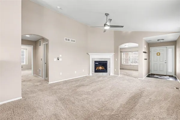 en view interior of a house with an empty space and a fireplace