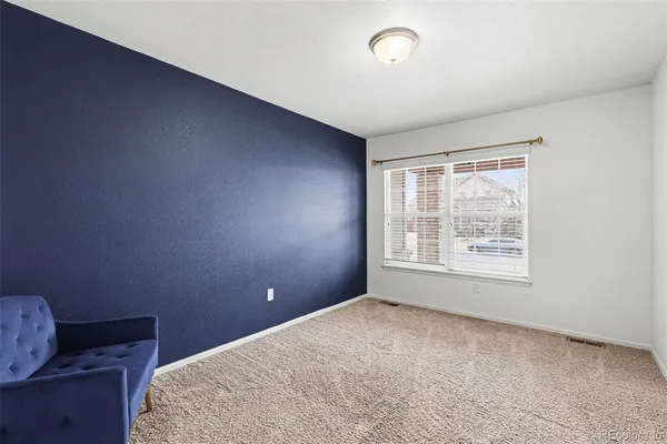 a hallway with a couch and a dresser