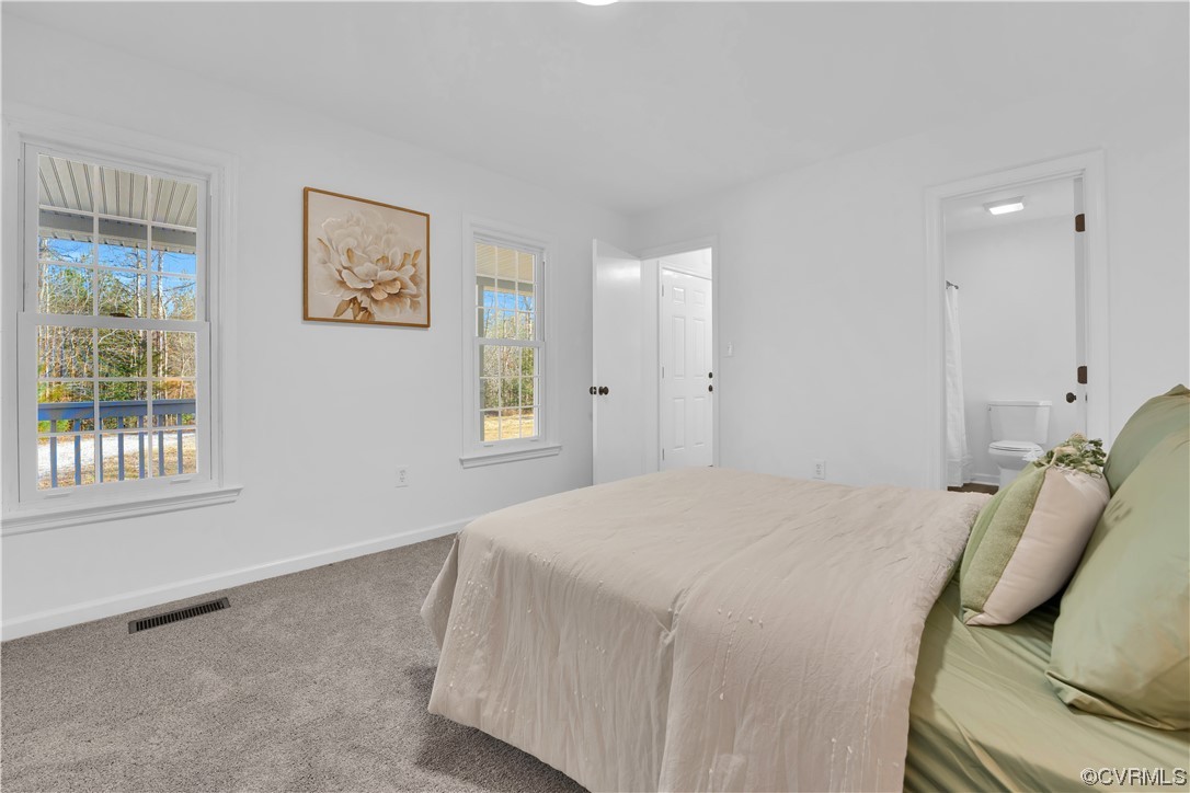 13600 Bradley Bridge Road Chester, VA 23831 - Photo 35 of 50 a bedroom with a bed and wooden floor