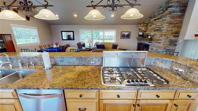 a living room with fireplace furniture dining table and a fireplace
