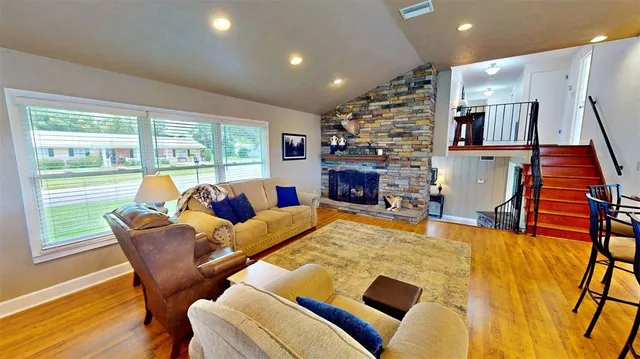 a bathroom with a bathtub sink and mirror