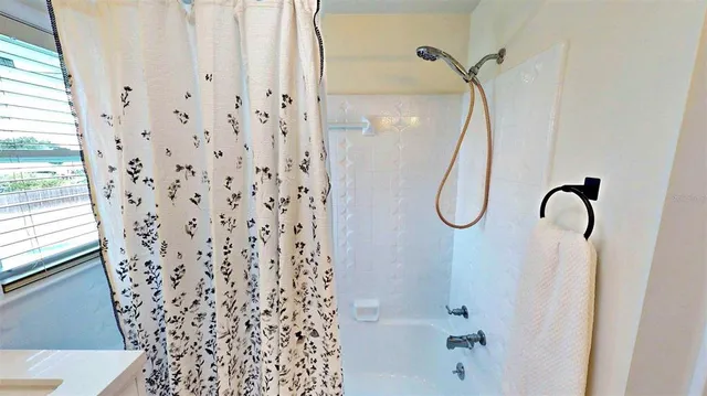 a bed room with a bed and wooden floor