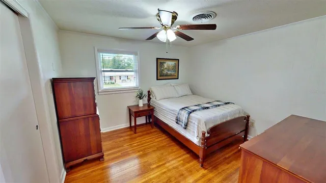 a bedroom with a bed and a dresser