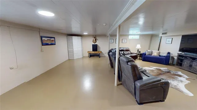 a bathroom with a sink a large mirror and a bathtub