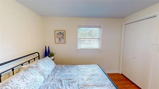 a bedroom with bed and window
