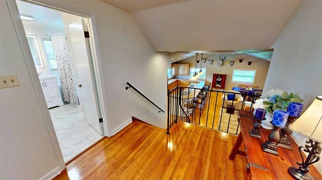 a dining room with furniture and a window