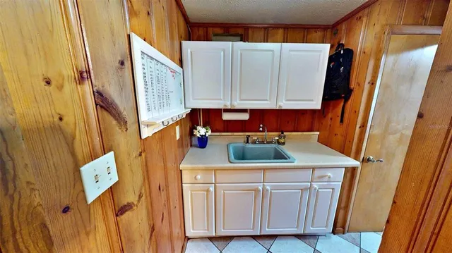 a storage room with lots of clutter and furniture