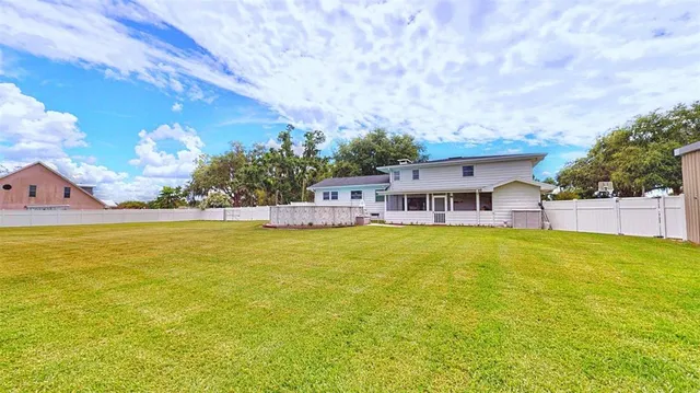 a view of a back yard of the house