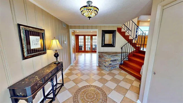 a view of an entryway with wooden floor