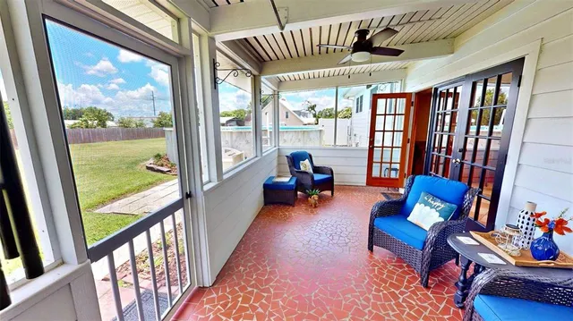 a living room with furniture and stairs