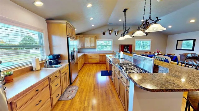 a view of a living room and kitchen