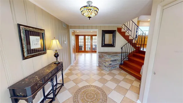 a very nice looking kitchen with granite countertop a large kitchen island in the center