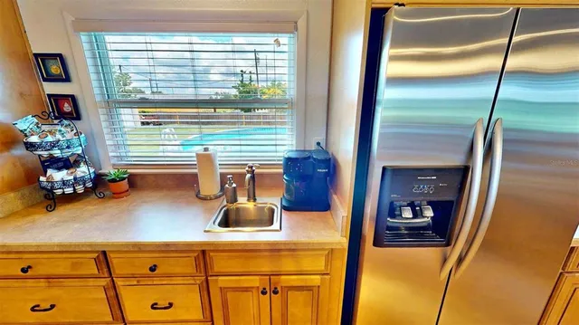 a kitchen with stainless steel appliances granite countertop a sink and cabinets